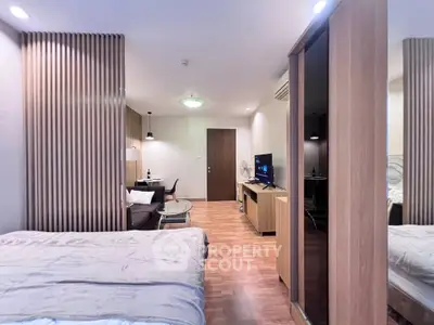 Modern studio apartment with wooden accents and cozy living area