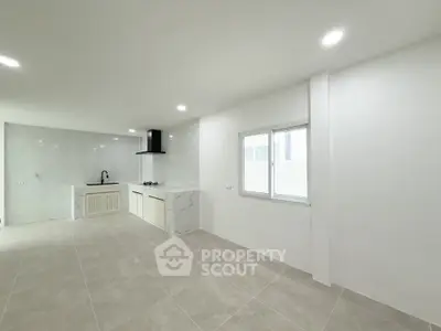 Spacious modern kitchen with sleek design and ample natural light