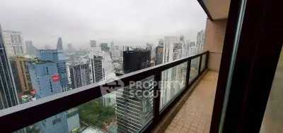 Stunning cityscape view from high-rise balcony in urban setting.