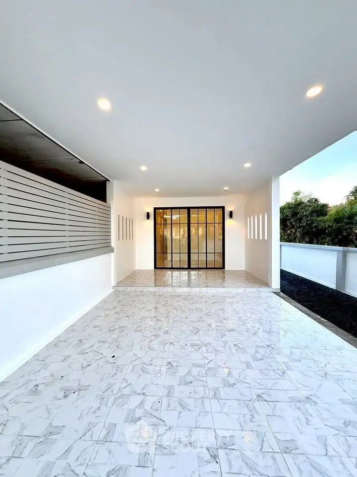 Elegant modern entrance with marble flooring and glass doors, perfect for luxury living.