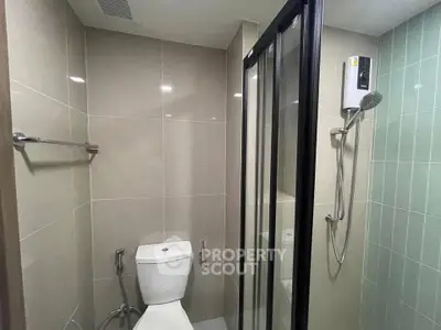 Modern bathroom with glass shower and sleek tile design