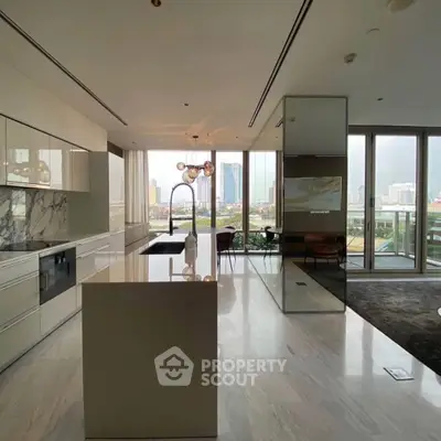 Luxurious modern kitchen with marble island and stunning city view