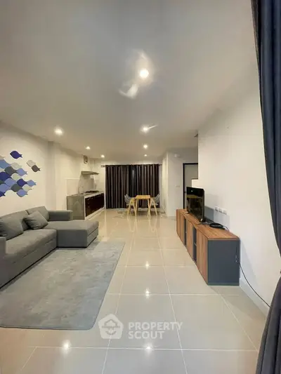 Spacious modern living room with sleek furniture and open layout