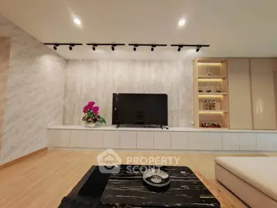 Modern living room with sleek TV setup and elegant decor