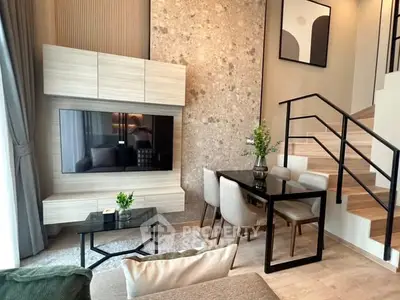 Modern living room with stylish decor and open staircase