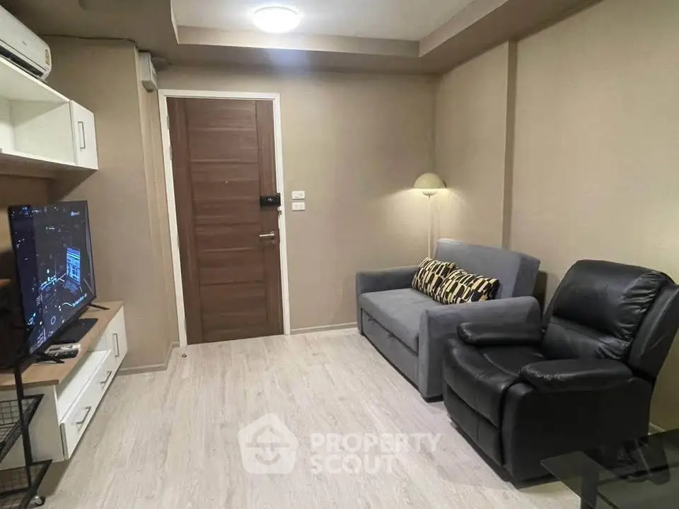 Cozy living room with modern furniture and TV setup