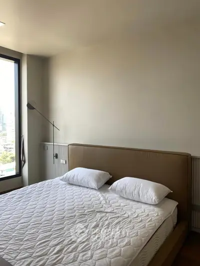 Modern bedroom with large window and stylish bed in urban apartment