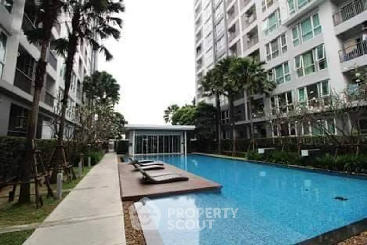 Luxurious condominium with stunning pool and modern architecture.