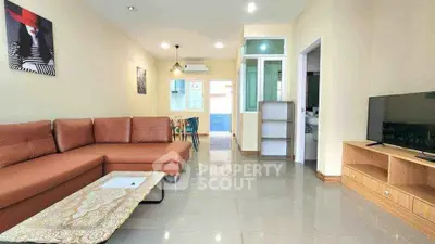 Spacious living room with modern decor and large brown sectional sofa