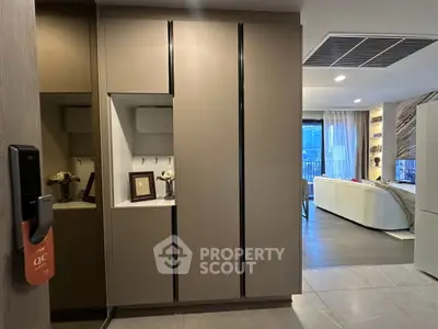 Modern apartment interior with sleek storage and cozy living area