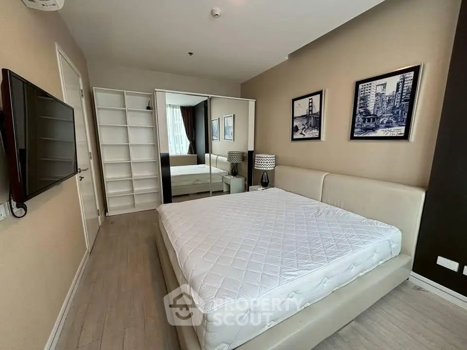 Modern bedroom with stylish decor and ample storage space