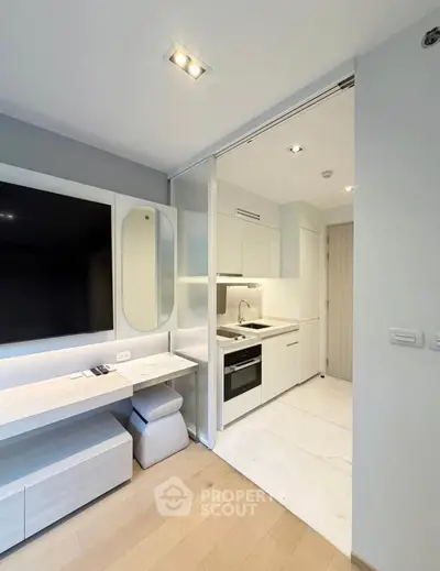 Modern open-layout kitchen with sleek appliances and stylish decor