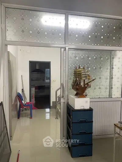 Modern interior with frosted glass panels and sleek storage solutions