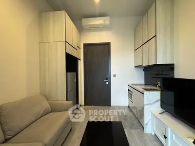 Modern compact living room with integrated kitchen and sleek design