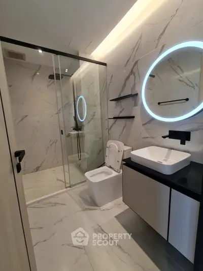 Luxurious modern bathroom with marble tiles and sleek fixtures