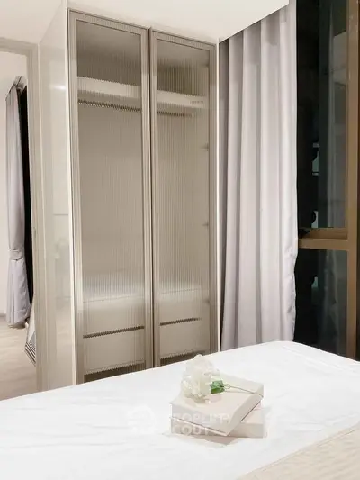 Modern bedroom with sleek wardrobe and elegant decor