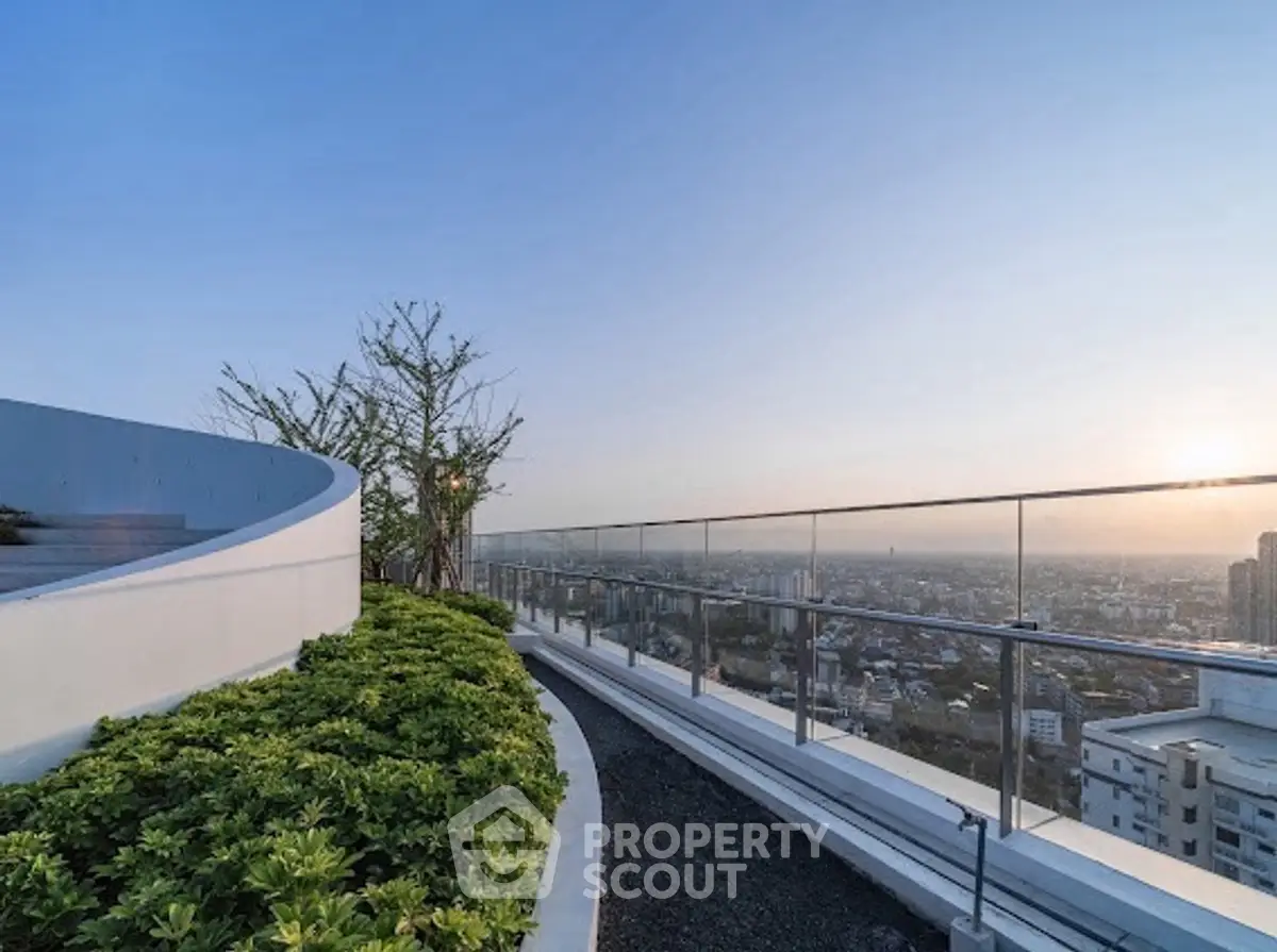 Stunning rooftop with panoramic city view and modern glass railing.