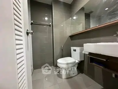 Modern bathroom with sleek design and contemporary fixtures in a stylish apartment.