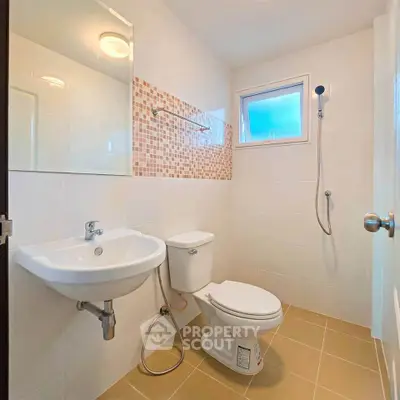 Modern bathroom with sleek fixtures and stylish tile accents