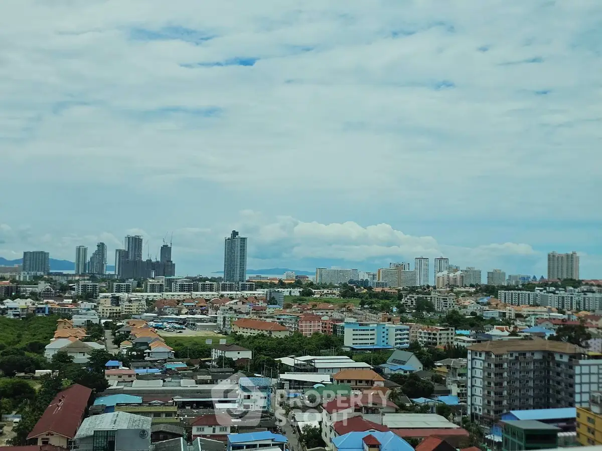 Stunning cityscape view with diverse architecture and skyline under a vibrant sky.