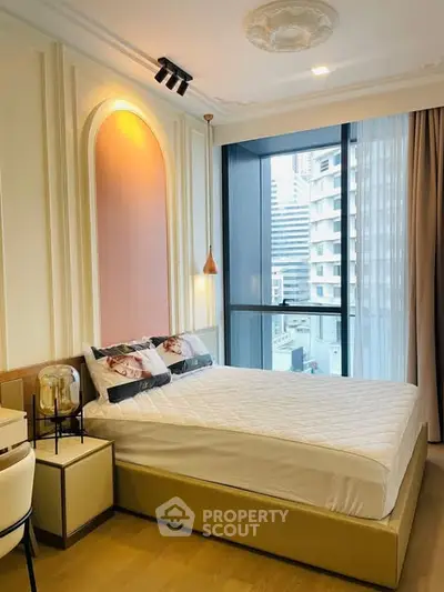 Modern bedroom with stylish decor and city view from large window.