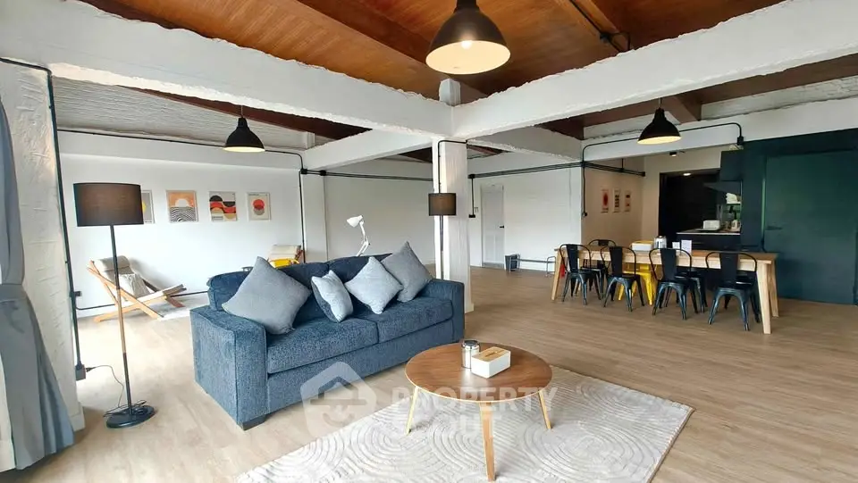 Spacious modern living room with stylish decor and open layout, perfect for entertaining.