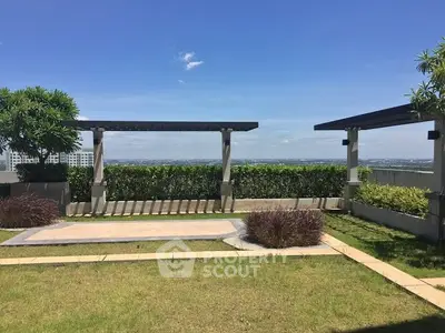 Stunning rooftop garden with panoramic city views and lush greenery.