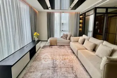 Luxurious modern living room with elegant decor and ample natural light