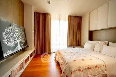 Luxurious bedroom with elegant decor and natural light, featuring a cozy bed and stylish curtains.