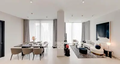 Spacious modern living and dining area with elegant decor and natural light.