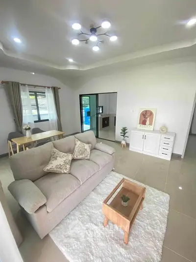 Spacious living room with modern decor and natural light