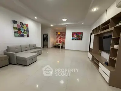 Spacious modern living room with elegant decor and ample natural light