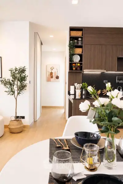Modern open-plan kitchen and dining area with stylish decor and natural light.
