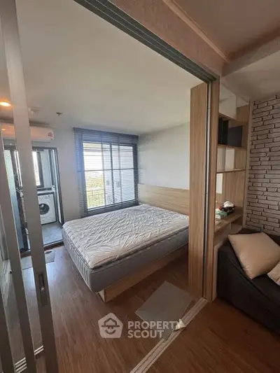 Modern bedroom with sliding glass doors and natural light