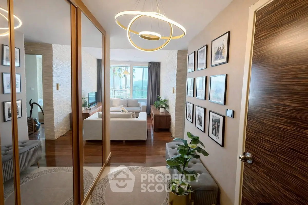 Stylish modern living room with elegant decor and large windows offering natural light.