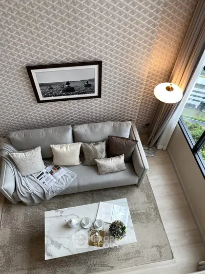 Stylish living room with modern decor and large window view
