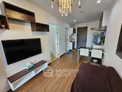 Modern living room with wooden flooring and stylish shelving in a cozy apartment.