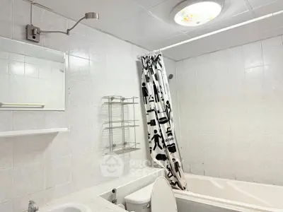 Spacious bathroom with modern fixtures and a stylish bathtub, perfect for relaxation.
