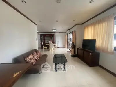 Spacious living room with modern furniture and natural light