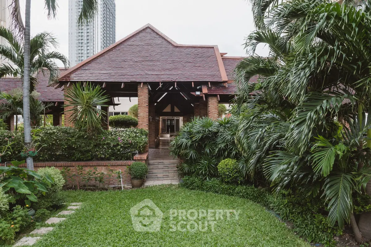 Charming tropical-style house with lush garden and inviting entrance