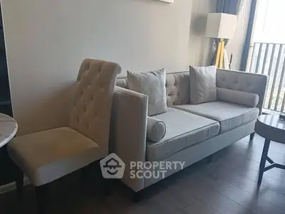 Modern living room with elegant beige sofa and chair, perfect for stylish comfort.