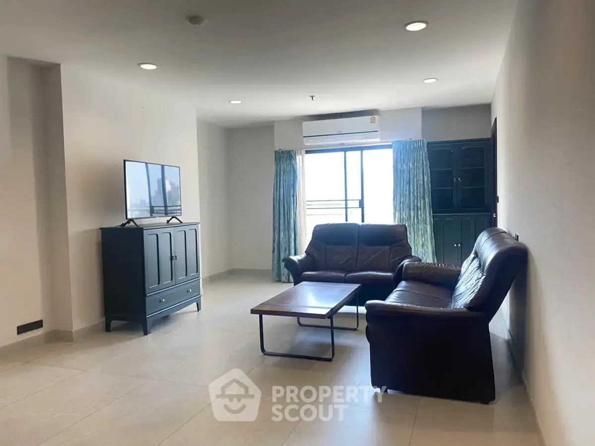 Spacious living room with modern furniture and natural light