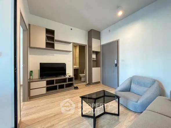 Modern living room with sleek furniture and open layout, perfect for urban living.