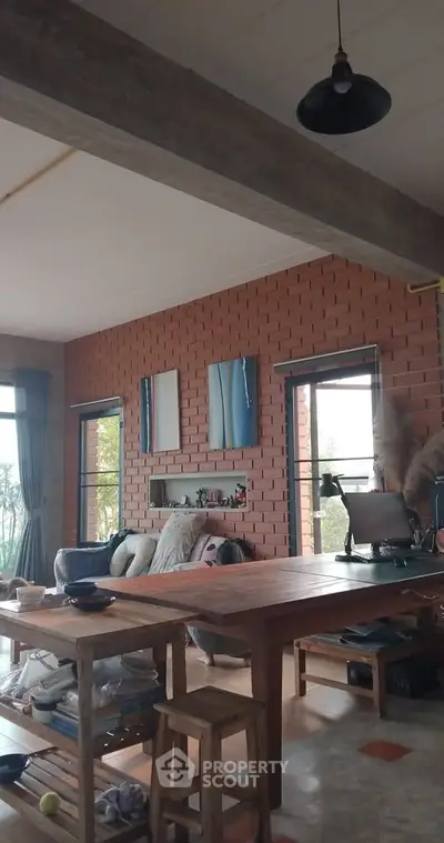 Charming living room with exposed brick wall and cozy seating area