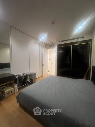 Modern bedroom with sleek design and ample storage space