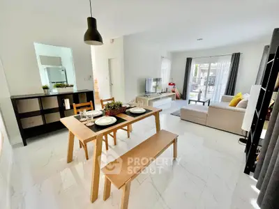 Modern open-plan living room with dining area and stylish decor
