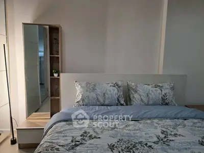 Cozy bedroom with floral bedding and modern decor