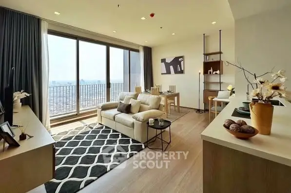 Modern living room with large windows and stylish decor, offering a bright and inviting atmosphere.
