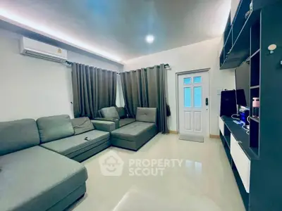 Modern living room with sleek furniture and ambient lighting