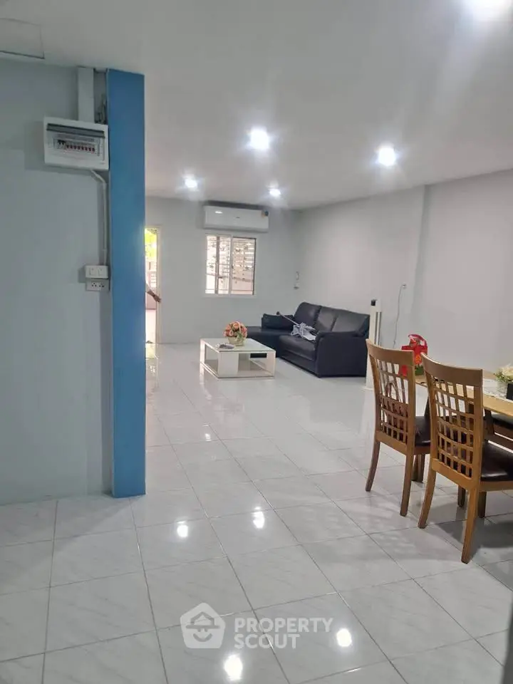 Spacious living room with modern furniture and bright lighting